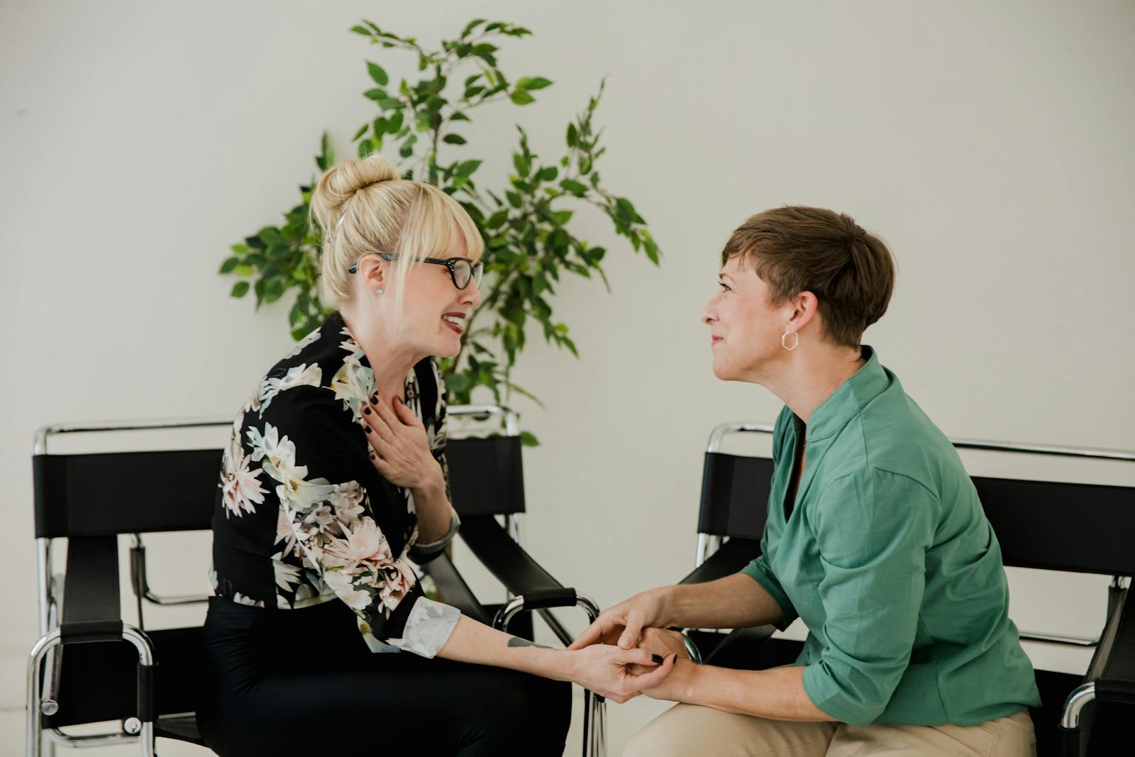 Two women in supportive, attentive conversation